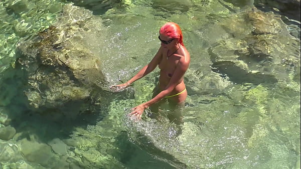 Yellow swimming trunks and blue water