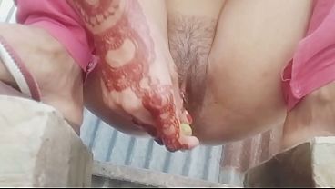 Bangladeshi village girl doing with cucumber